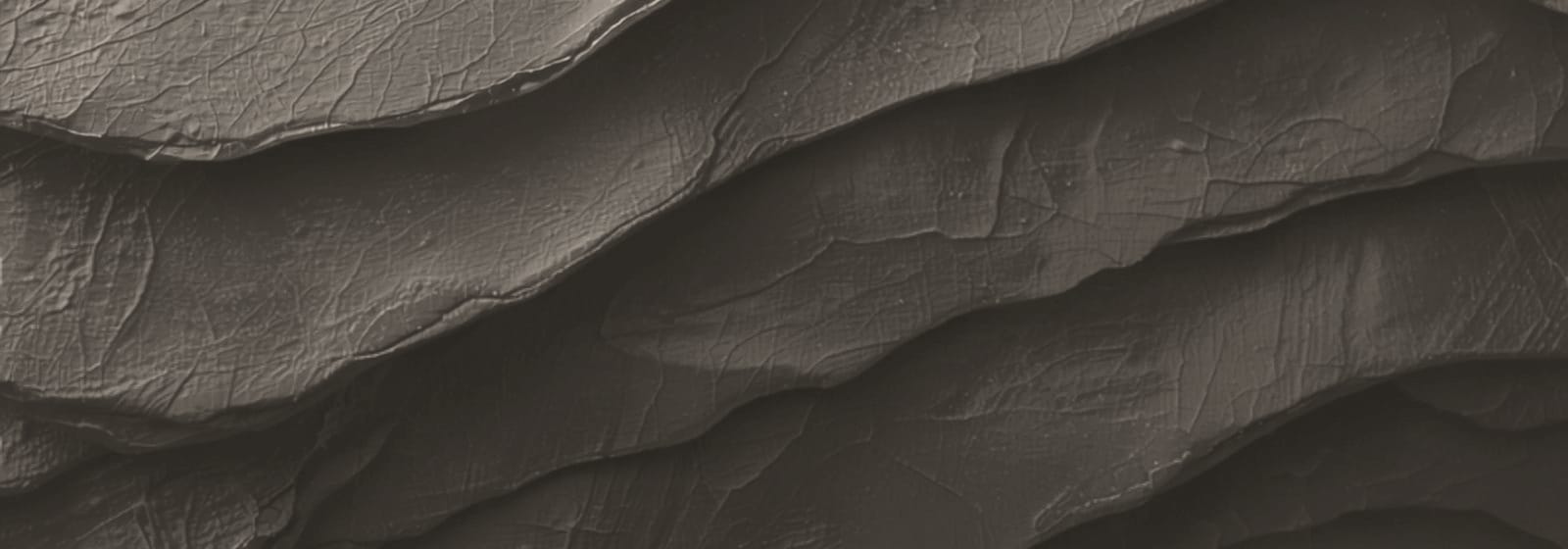 Stone & Pillar strata artwork, plate 26: layered rock in warm stone, the colour this site uses for planning & development matters.
